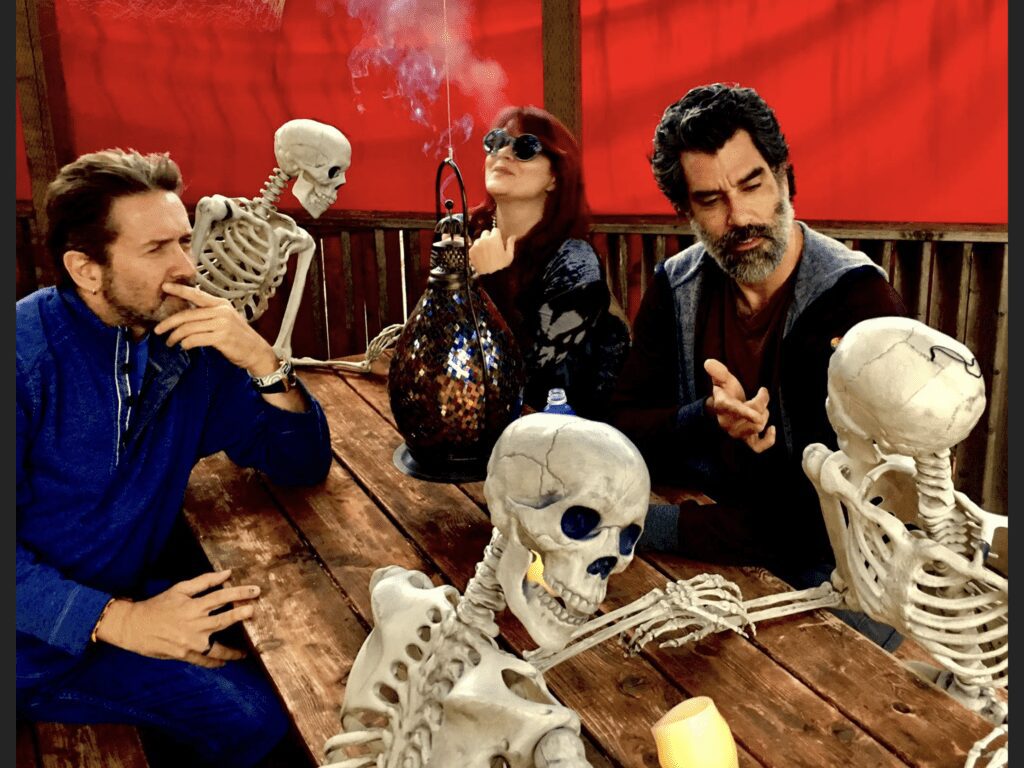 Carolyn Wonderland with bandmates and skeletons